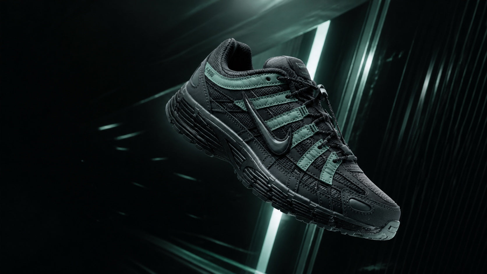 Nike P-6000 Anthracite Clay Green suspended in a dark technical space